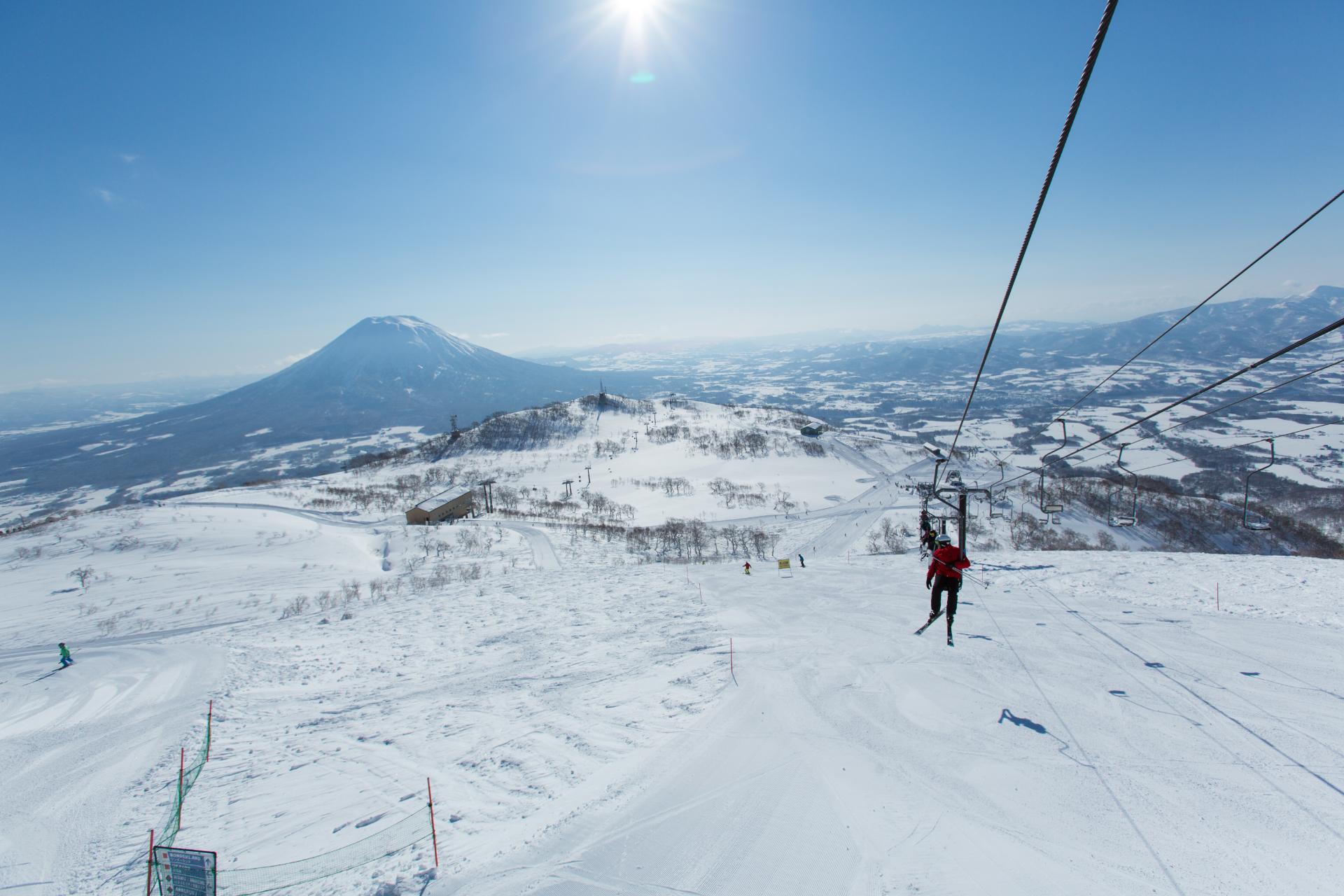 Views of Mt. Yotei typically accompany the vast range of intermediate terrain in Niseko Village ski area © Niseko