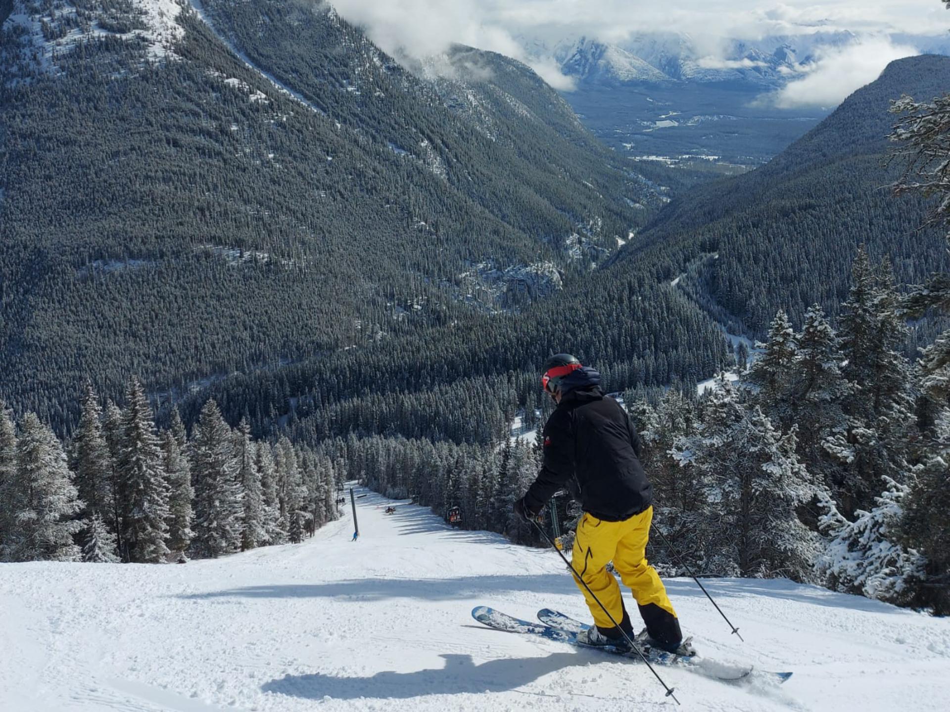 Rupert skiing wide, empty blues in Mt. Norquay on a sunny winter day Rupert skiing wide, empty blues in Mt. Norquay on a sunny winter day